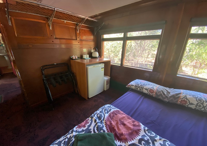 Railway Carriages Undara Experience living area, bed setup